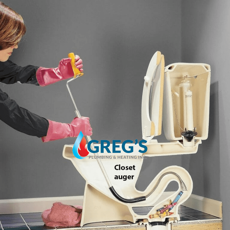 women using Toilet Auger to unclog toilet