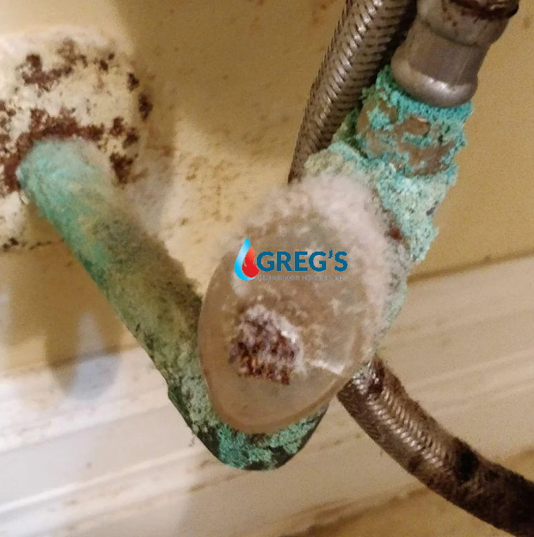 shutoff valves under the sink look crusty, green, rusty, or damp